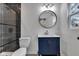 Modern bathroom with a new sink, toilet, and tile in the shower at 614 Park Ave, Anderson, IN 46012