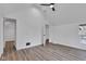 Bedroom with wood-look flooring and an open door at 614 Park Ave, Anderson, IN 46012