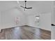 Spacious bedroom with wood-look flooring and two windows at 614 Park Ave, Anderson, IN 46012