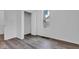 Bright, minimalist bedroom with modern flooring, neutral walls, a closet, and a window offering natural light at 614 Park Ave, Anderson, IN 46012