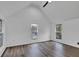 Bedroom with wood-look flooring and a view of a window at 614 Park Ave, Anderson, IN 46012