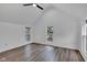 Bright bedroom featuring hardwood floors, a ceiling fan, and plenty of natural light from the windows at 614 Park Ave, Anderson, IN 46012