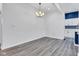 Bright dining room featuring new floors and contemporary light fixture at 614 Park Ave, Anderson, IN 46012