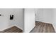 Hallway featuring wood-look flooring and a view of an electrical panel at 614 Park Ave, Anderson, IN 46012