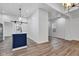 The kitchen has an island with a blue base and a sliding barn door at 614 Park Ave, Anderson, IN 46012