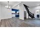 Open-concept living room with hardwood floors and an elegant color scheme at 614 Park Ave, Anderson, IN 46012