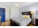This bedroom features a wood bed frame, wood floors, and a closet at 6194 Evanston Ave, Indianapolis, IN 46220