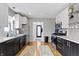 Bright kitchen features stainless steel appliances and updated two-tone cabinets at 6194 Evanston Ave, Indianapolis, IN 46220