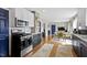 This renovated kitchen features stainless steel appliances and an open design at 6194 Evanston Ave, Indianapolis, IN 46220