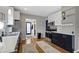 Well-lit kitchen featuring stainless steel appliances and contrasting cabinetry colors at 6194 Evanston Ave, Indianapolis, IN 46220