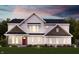 Charming two-story home with red front door, stone accents, and lush green lawn at 6217 Hampton Walk Blvd, McCordsville, IN 46055