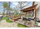 Backyard deck featuring a pergola, seating area, lake view, and playset at 693 Prince Dr, Greenwood, IN 46142