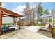 Backyard deck featuring a pergola, multiple seating areas, outdoor furniture, and lake views at 693 Prince Dr, Greenwood, IN 46142