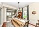 Bright dining room showcases a wood table with bench seating and open access to living area at 693 Prince Dr, Greenwood, IN 46142