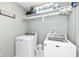 This laundry room features a washer, dryer, and shelving for linens and laundry supplies at 693 Prince Dr, Greenwood, IN 46142