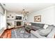 This living room features a fireplace, built-in shelving, hardwood floors, and a plush sectional sofa at 693 Prince Dr, Greenwood, IN 46142