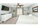 Spacious carpeted main bedroom with ceiling fan, television, serene paint color, and large window at 693 Prince Dr, Greenwood, IN 46142