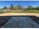 New construction home backyard featuring a fresh concrete patio and leveled lot ready for landscaping at 7215 Barrett Dr, Brownsburg, IN 46112