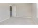 Bedroom features plush carpeting, neutral walls, and a doorway, creating a cozy retreat at 7215 Barrett Dr, Brownsburg, IN 46112