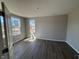 Bedroom with hardwood floors and two windows providing natural light at 7215 Barrett Dr, Brownsburg, IN 46112