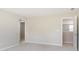 Bedroom features plush carpeting, neutral walls, and doorways leading to the closet and hallway at 7215 Barrett Dr, Brownsburg, IN 46112