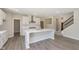 Bright kitchen with white cabinets, stainless steel appliances, and an island at 7215 Barrett Dr, Brownsburg, IN 46112