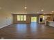 Large living room area featuring hardwood floors, great natural light, and neutral paint at 7215 Barrett Dr, Brownsburg, IN 46112