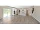 Spacious living area with kitchen, stairs, and natural light at 7215 Barrett Dr, Brownsburg, IN 46112