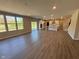Open-concept living area featuring hardwood floors and large windows offering ample natural light at 7215 Barrett Dr, Brownsburg, IN 46112
