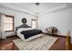 Spacious bedroom with hardwood floors, neutral decor, and large windows providing ample natural light at 7340 Stones River Dr, Indianapolis, IN 46259