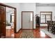 Welcoming foyer featuring hardwood floors and an elegant entryway with a coat rack and rug at 7340 Stones River Dr, Indianapolis, IN 46259