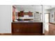 Modern kitchen featuring dark wood cabinets, sleek countertops, and stainless steel appliances at 7340 Stones River Dr, Indianapolis, IN 46259