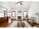 Bright and airy living room with hardwood floors, fireplace, and a comfortable seating area at 7340 Stones River Dr, Indianapolis, IN 46259