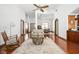 Spacious living room with hardwood floors, high ceilings, and comfortable seating arrangement at 7340 Stones River Dr, Indianapolis, IN 46259