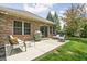 Outdoor patio area featuring comfortable seating and a built-in grill, perfect for entertaining at 7340 Stones River Dr, Indianapolis, IN 46259