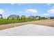 View of the backyard featuring a new concrete patio and an unobstructed view of the neighborhood at 8082 Abington Way, Zionsville, IN 46077