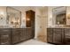 Spacious bathroom with dual vanities, granite counters, modern fixtures, and ample cabinet space in a contemporary design at 8082 Abington Way, Zionsville, IN 46077