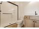 Stylish bathroom with a glass shower, wood vanity, and modern fixtures at 8082 Abington Way, Zionsville, IN 46077