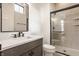 Modern bathroom featuring a glass-enclosed shower with a rainfall shower head, and a white vanity at 8082 Abington Way, Zionsville, IN 46077
