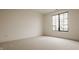 A minimalist bedroom with a window offering lots of natural light and neutral carpet at 8082 Abington Way, Zionsville, IN 46077
