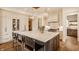 Gourmet kitchen with a large island, marble countertops, stainless steel appliances, and custom cabinetry at 8082 Abington Way, Zionsville, IN 46077