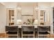 Modern kitchen featuring a marble countertop island, stainless steel appliances, and pendant lighting at 8082 Abington Way, Zionsville, IN 46077