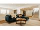 Comfortable living room with plush seating, a view of the bar, and an open floor plan at 8082 Abington Way, Zionsville, IN 46077