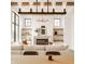 Comfortable living room featuring a fireplace, built-in shelves, and a large white sectional sofa at 8082 Abington Way, Zionsville, IN 46077