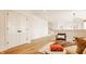 Bright living room featuring hardwood floors, white walls, a modern light fixture, and stylish decor at 8082 Abington Way, Zionsville, IN 46077