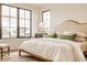 A bright main bedroom with large windows providing ample natural light and complementing the neutral color scheme at 8082 Abington Way, Zionsville, IN 46077
