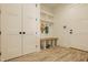 Bright mudroom with built-in bench, hooks, and storage at 8082 Abington Way, Zionsville, IN 46077