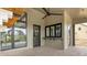 Covered patio with a bar area featuring sleek black windows at 8082 Abington Way, Zionsville, IN 46077