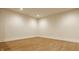 Unfinished basement with hardwood floors, white walls, and recessed lighting at 8092 Abington Way, Zionsville, IN 46077