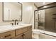 Modern bathroom with a glass shower, gray tile, toilet and vanity with sink at 8092 Abington Way, Zionsville, IN 46077